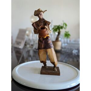 Art Crafts, Inc  Papier-macha man with pot
